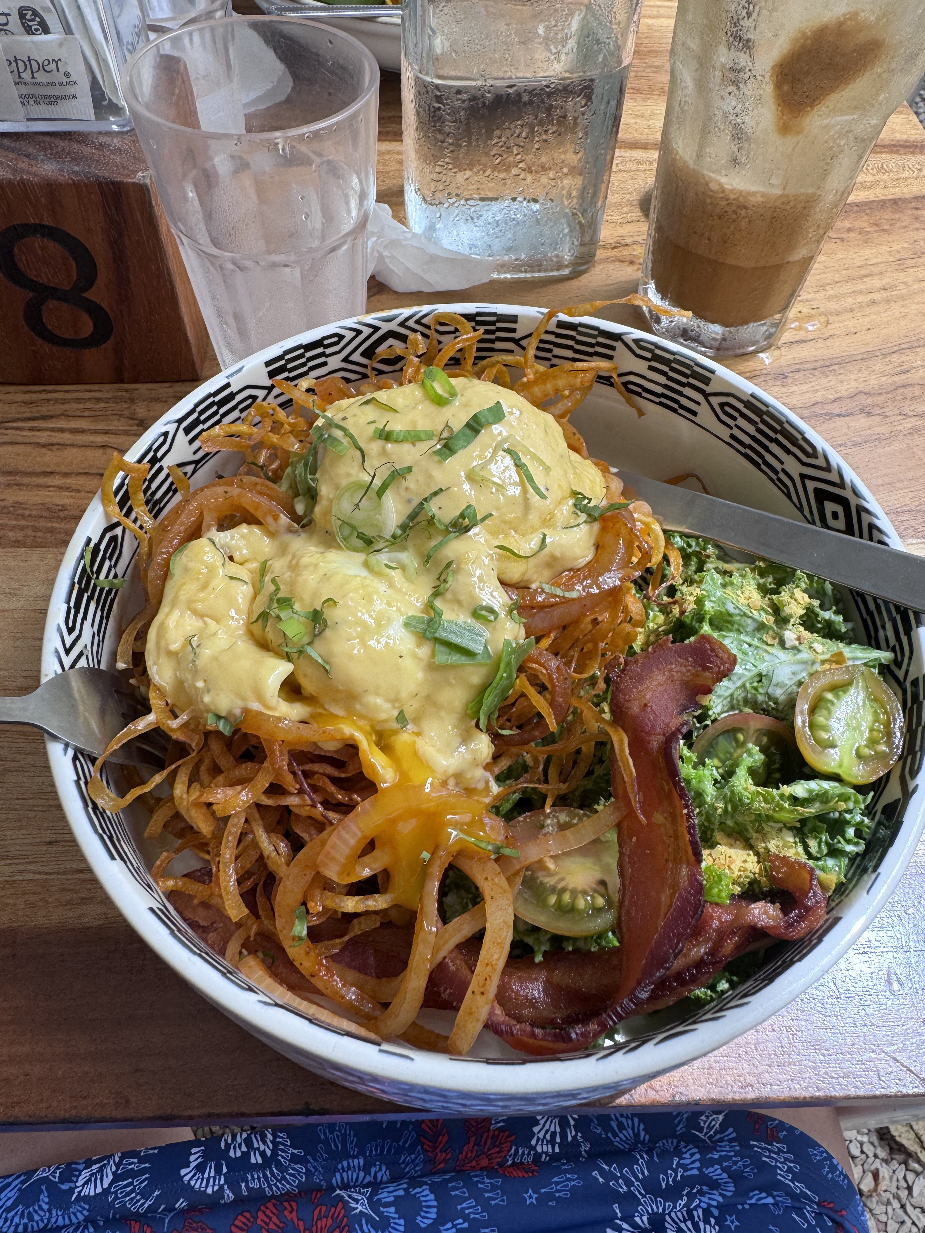 Poached eggs, bacon, and sweet potato breakfast- $15 in Nosara at a foodie hub